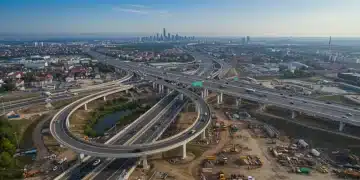 Modern highway interchange under construction, symbolizing infrastructure development and economic progress.