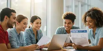 Students reviewing FAFSA documents and laptops for financial aid